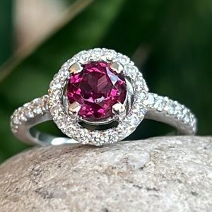 14 karat gold diamond and rodolite halo ring